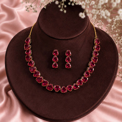 Antique Gold Plated Large CZ, Crystal & AD Studded Single Line Uneven Necklace Set with Earrings for Women - Maroon (SJN_362_M)